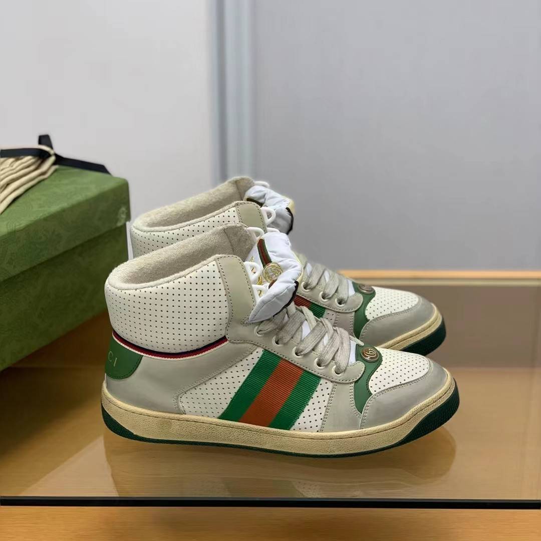 GU*IHigh-top Distressed sneakers
